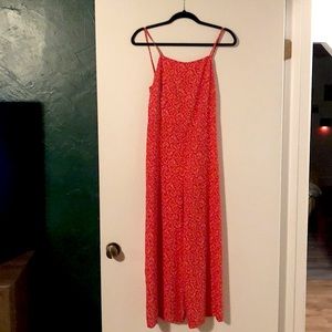 Bright red jumpsuit with white flower print